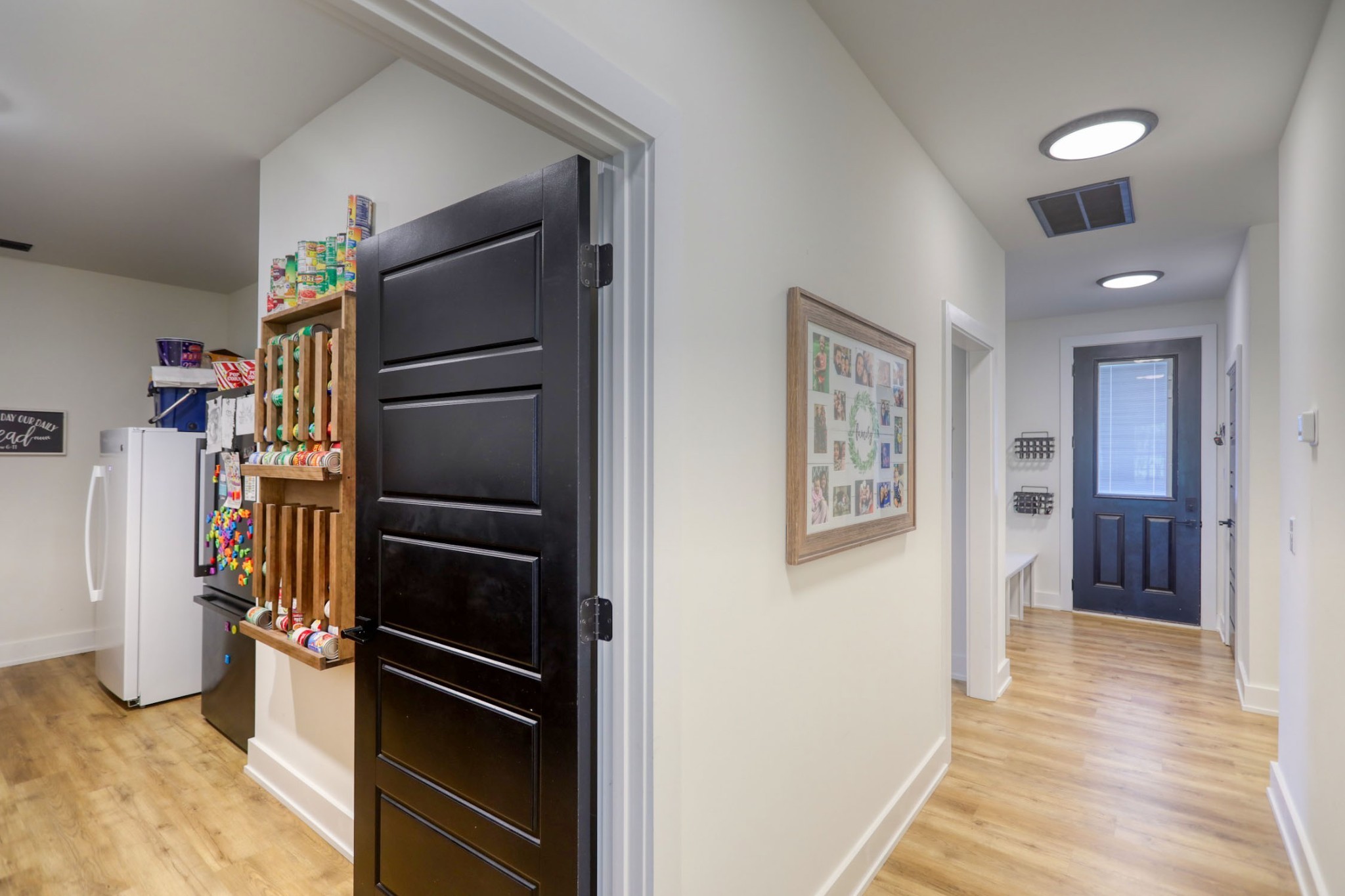 290 Dink Rut Road Portland, TN 37148 - Photo 12 of 56 a view of a refrigerator in kitchen and an empty room