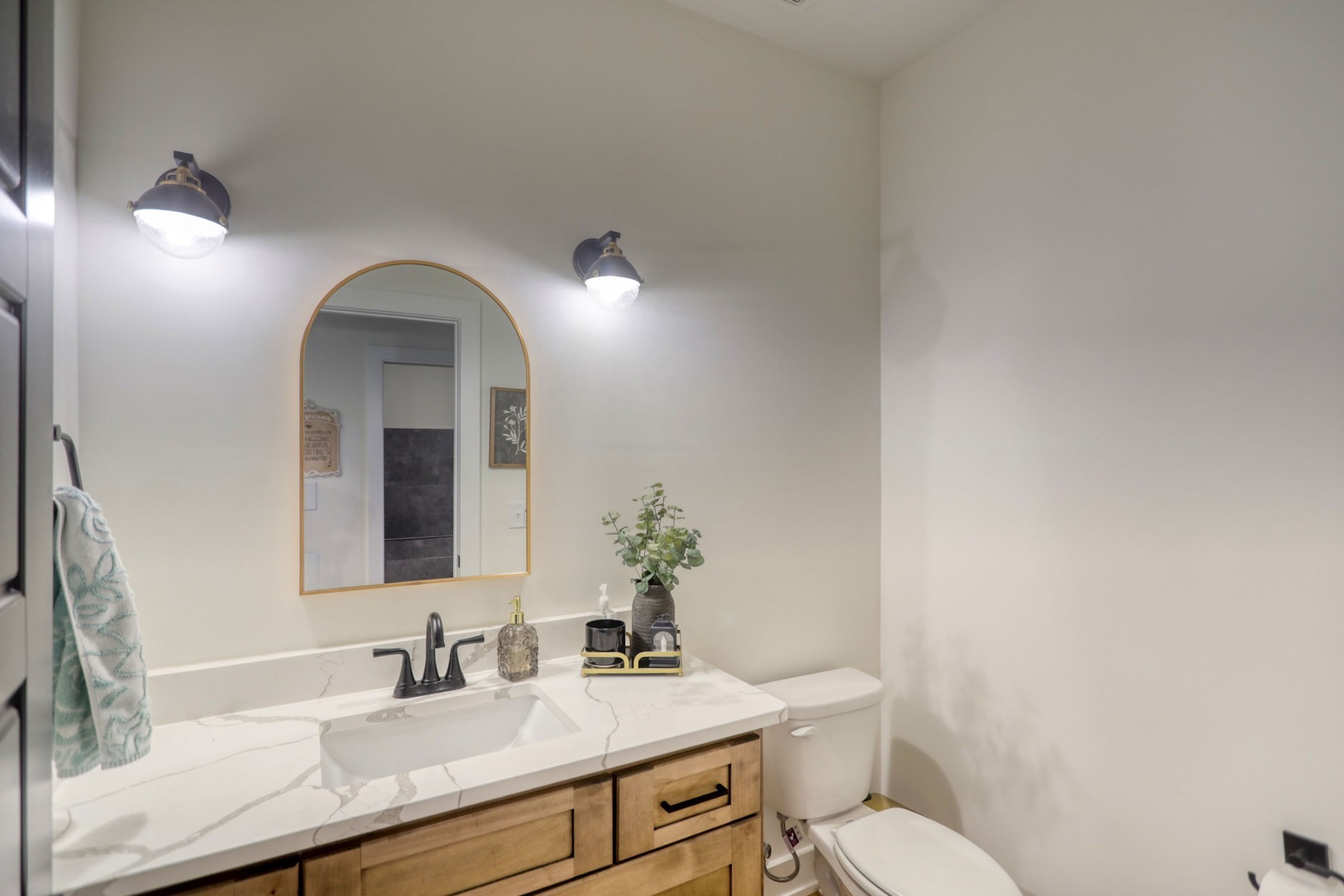 290 Dink Rut Road Portland, TN 37148 - Photo 15 of 56 a bathroom with a toilet sink and mirror
