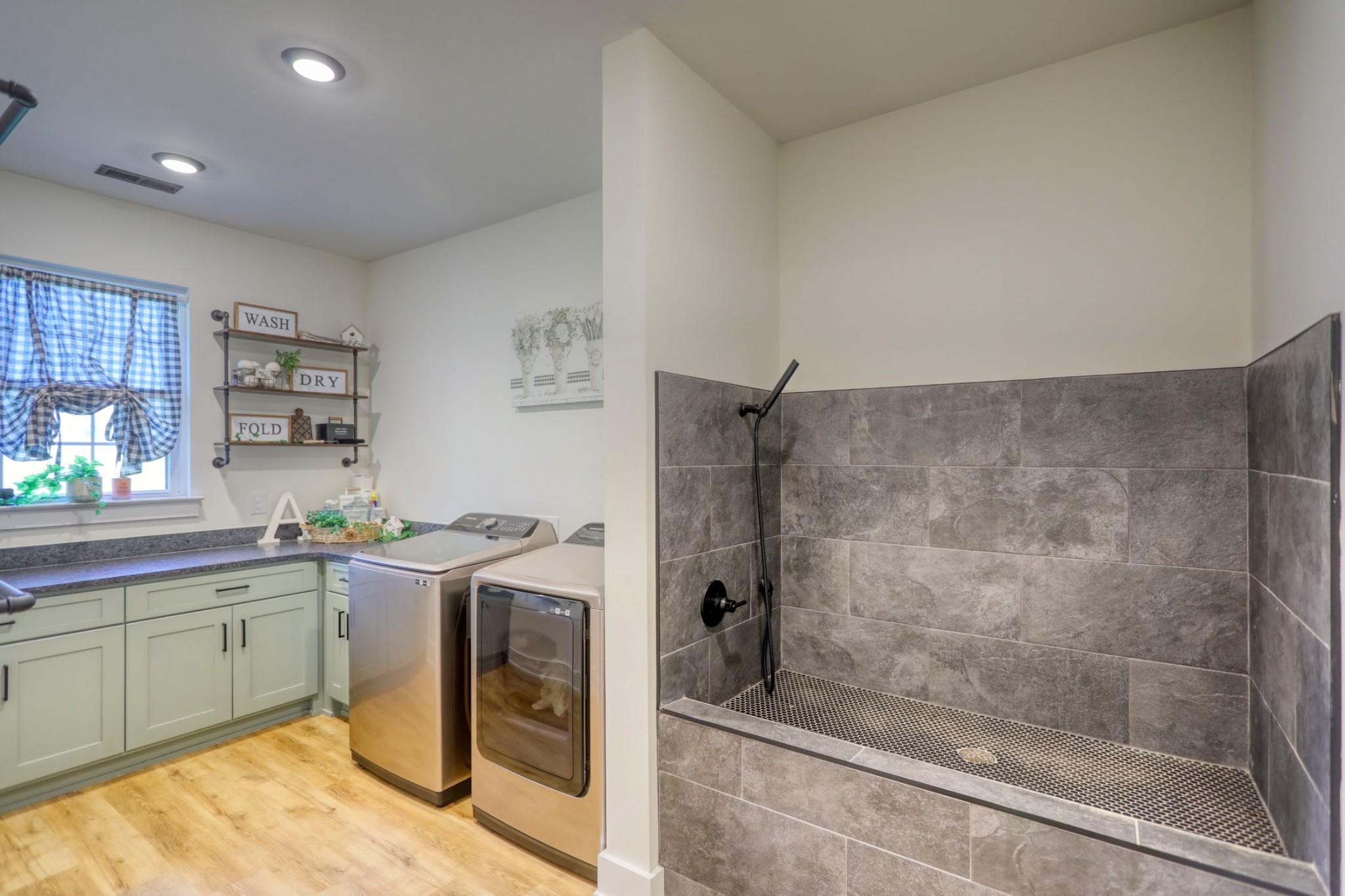 290 Dink Rut Road Portland, TN 37148 - Photo 18 of 56 a bathroom with a sink a washer and dryer