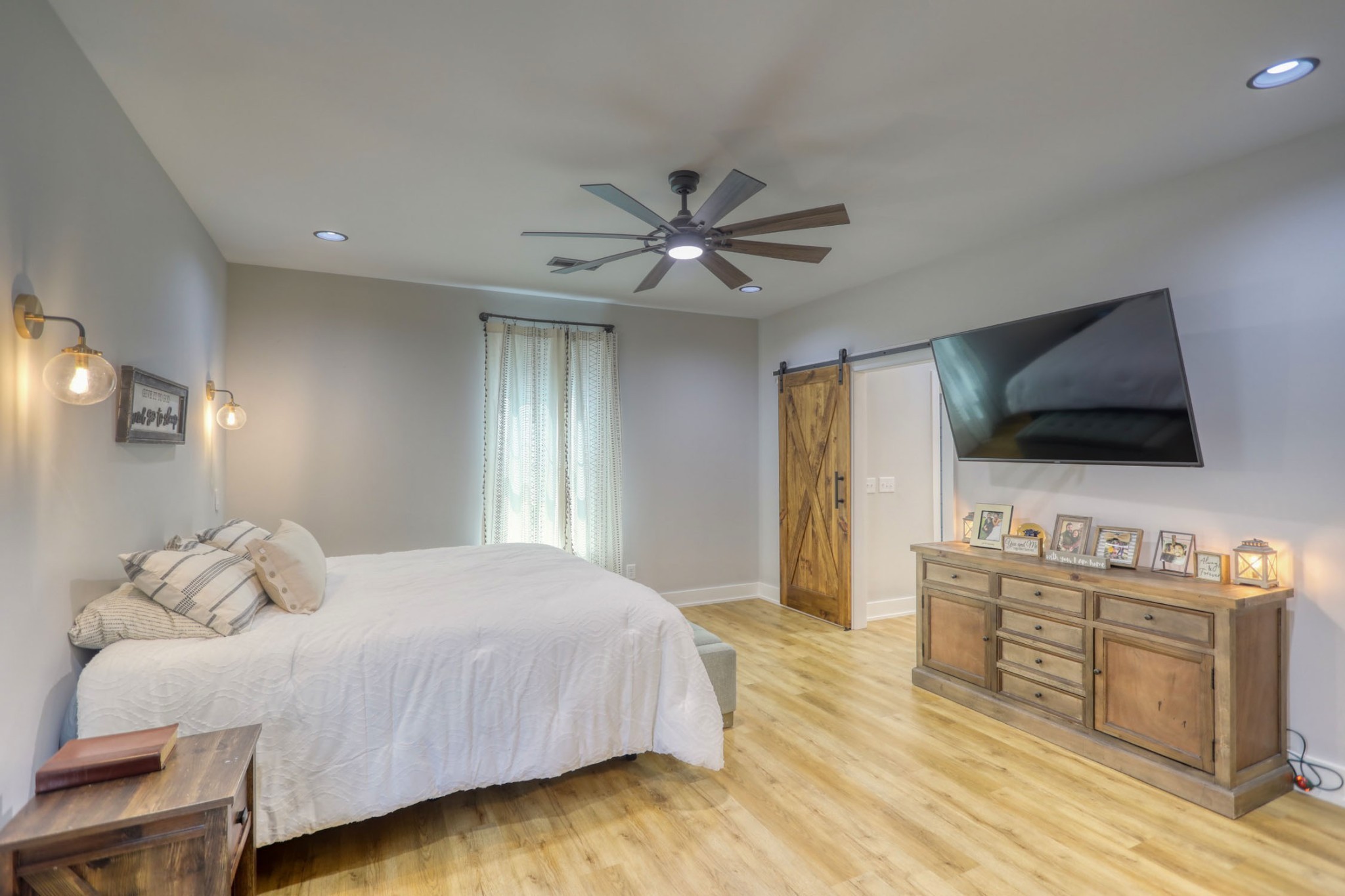 290 Dink Rut Road Portland, TN 37148 - Photo 21 of 56 a bedroom with a bed and a flat screen tv