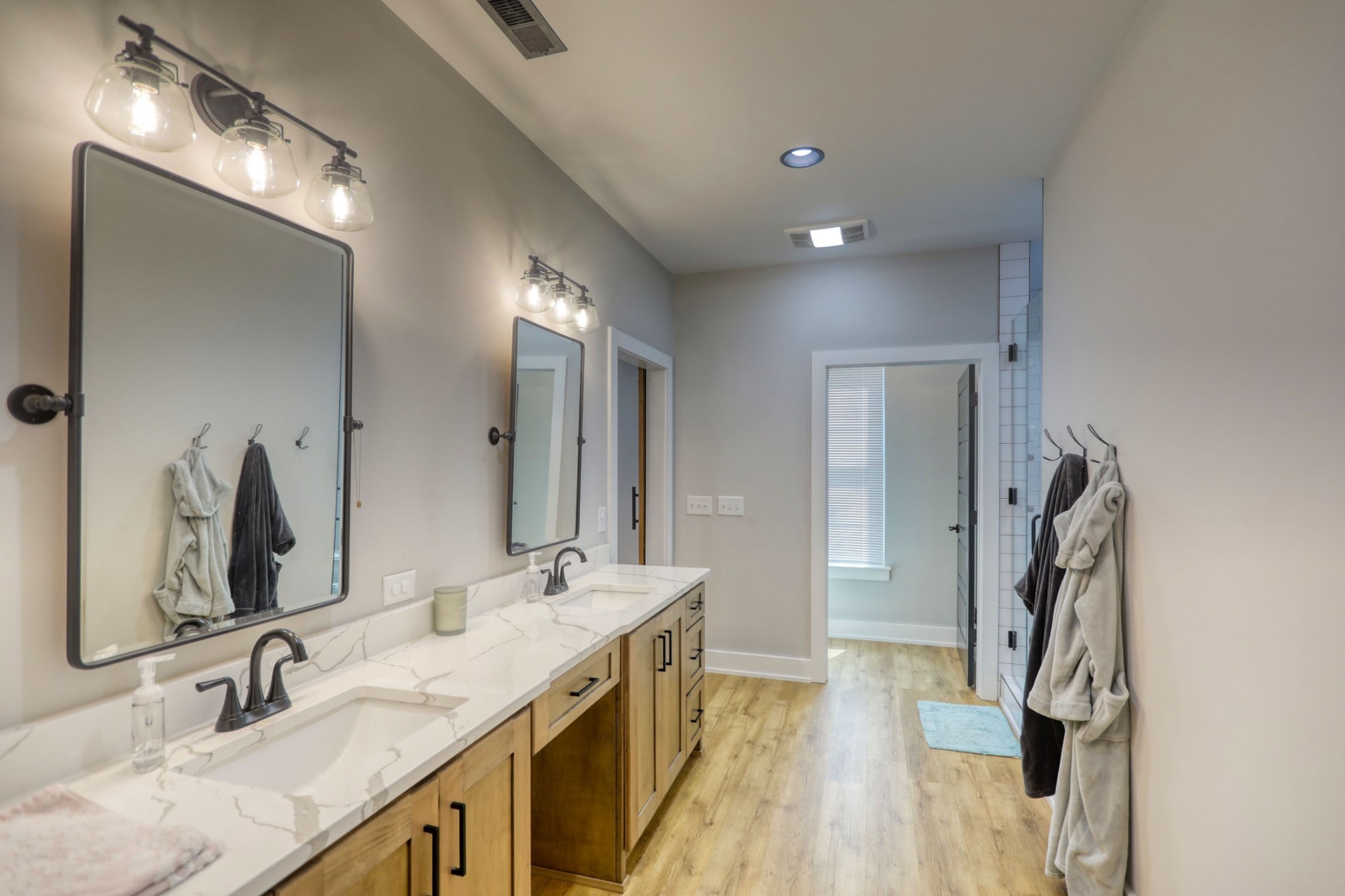 290 Dink Rut Road Portland, TN 37148 - Photo 27 of 56 a bathroom with a double vanity sink and a mirror