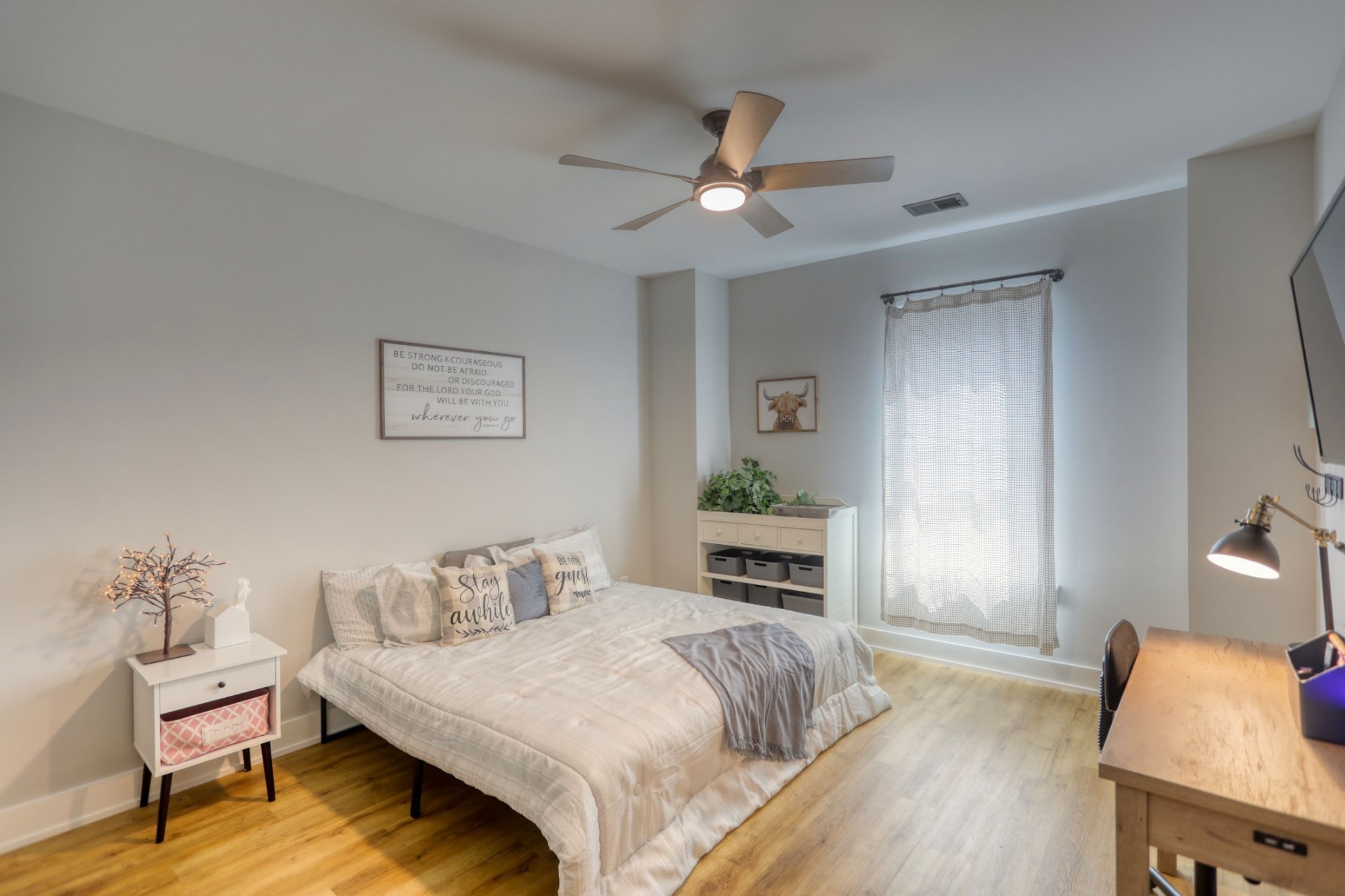 290 Dink Rut Road Portland, TN 37148 - Photo 34 of 56 a bedroom with a bed and a table in it