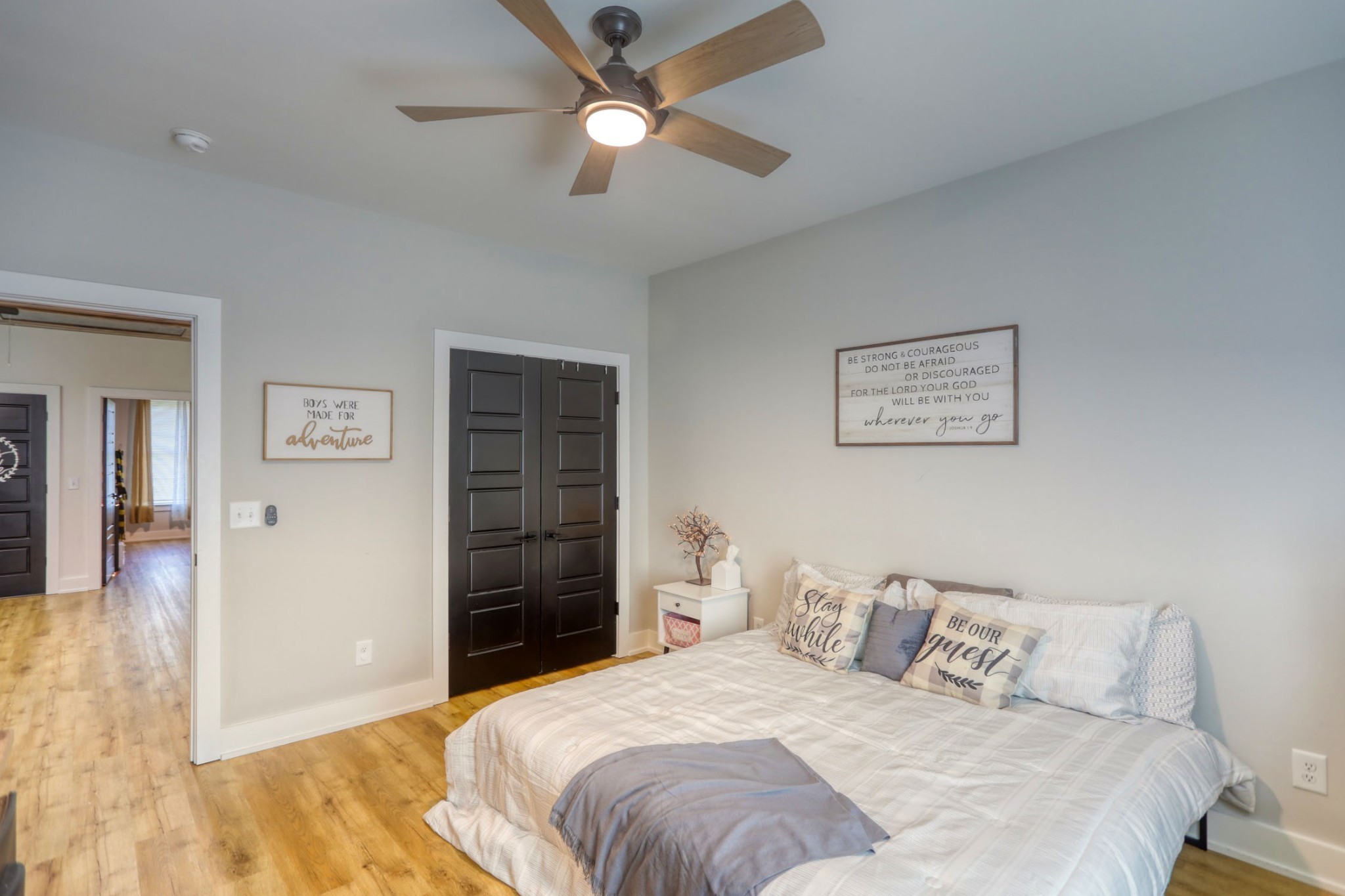 290 Dink Rut Road Portland, TN 37148 - Photo 35 of 56 a bedroom with a bed and a ceiling fan
