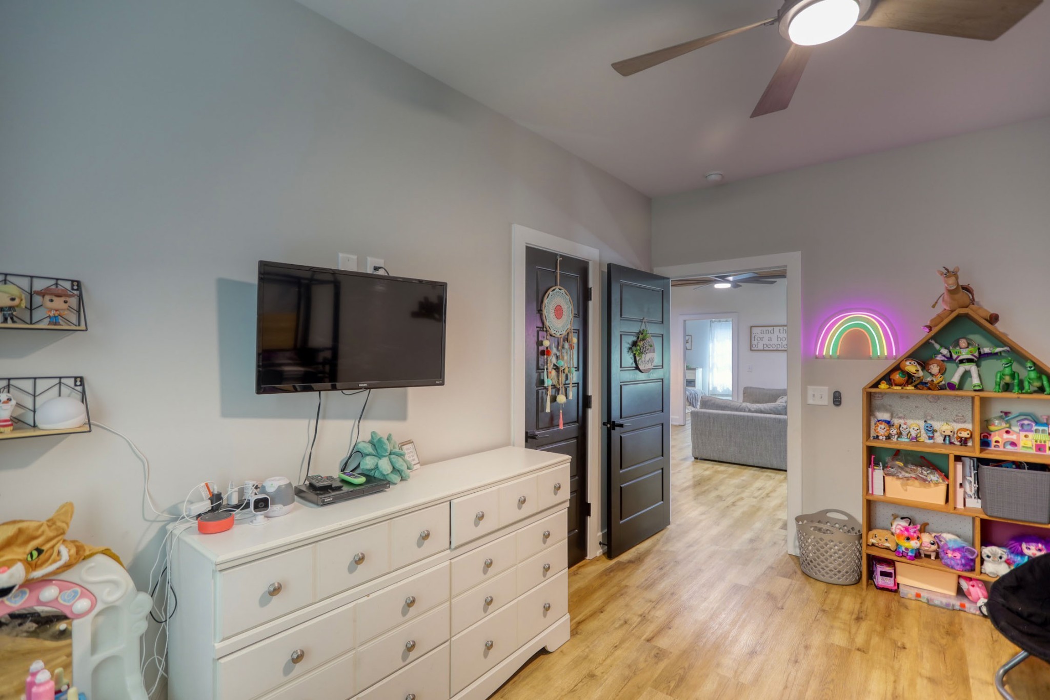 290 Dink Rut Road Portland, TN 37148 - Photo 42 of 56 a spacious bedroom with a bed and a flat tv screen on dresser