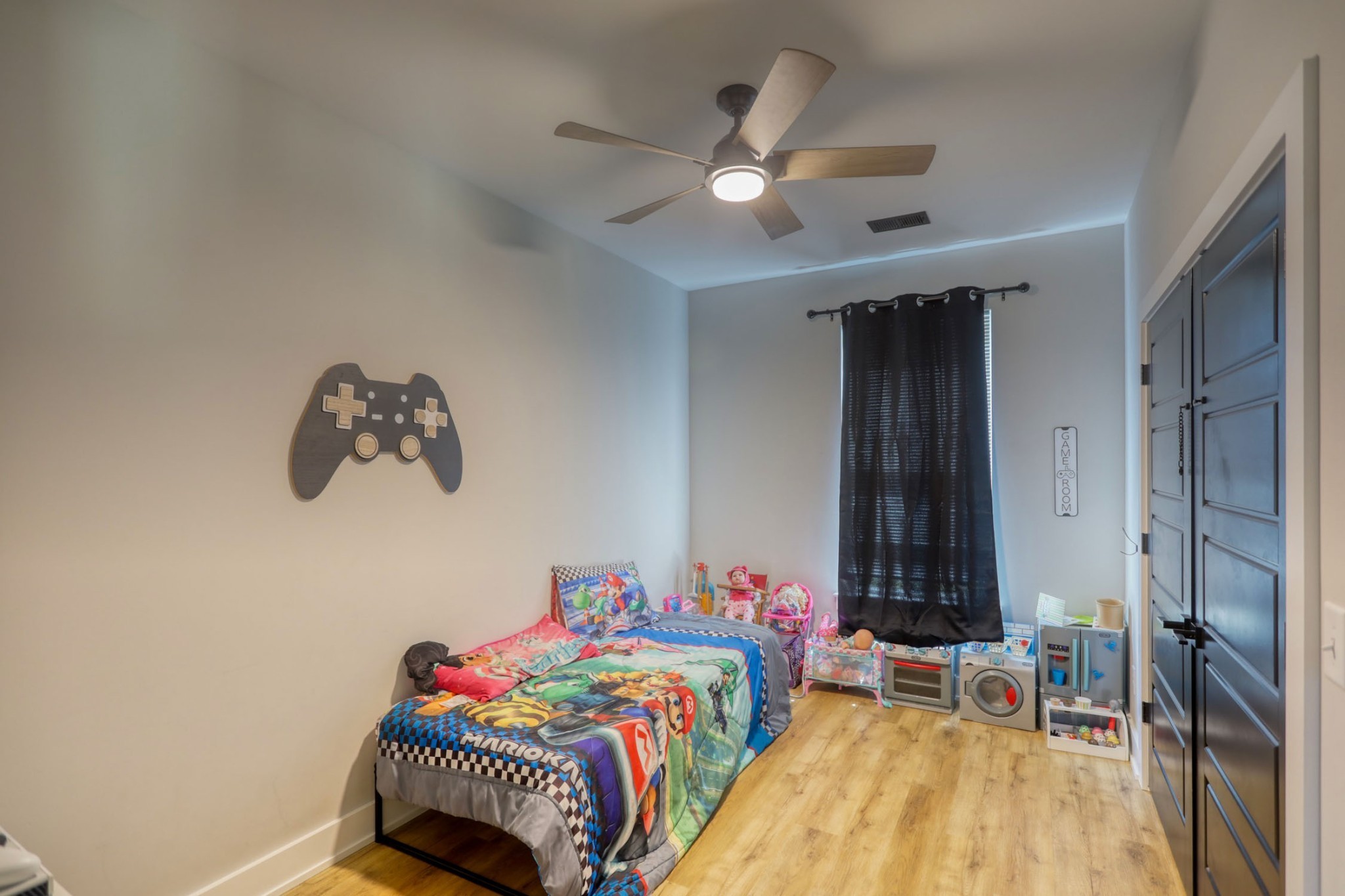 290 Dink Rut Road Portland, TN 37148 - Photo 43 of 56 a bedroom with a bed and a chandelier