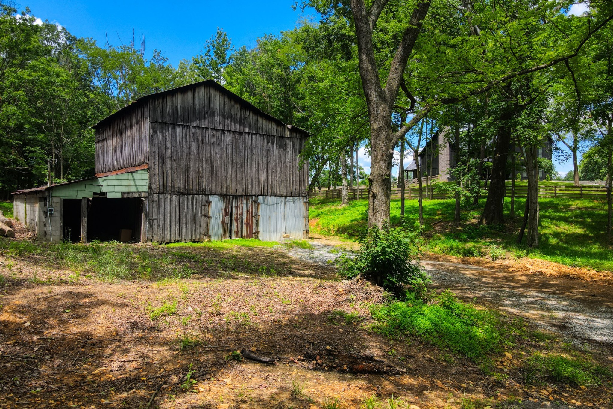 290 Dink Rut Road Portland, TN 37148 - Photo 48 of 56 a house with trees in the background