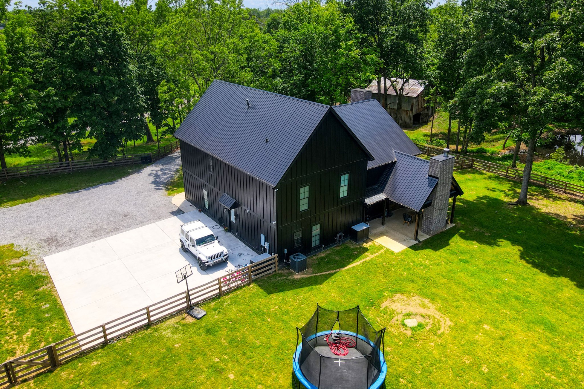 290 Dink Rut Road Portland, TN 37148 - Photo 53 of 56 an aerial view of a house with swimming pool and big yard