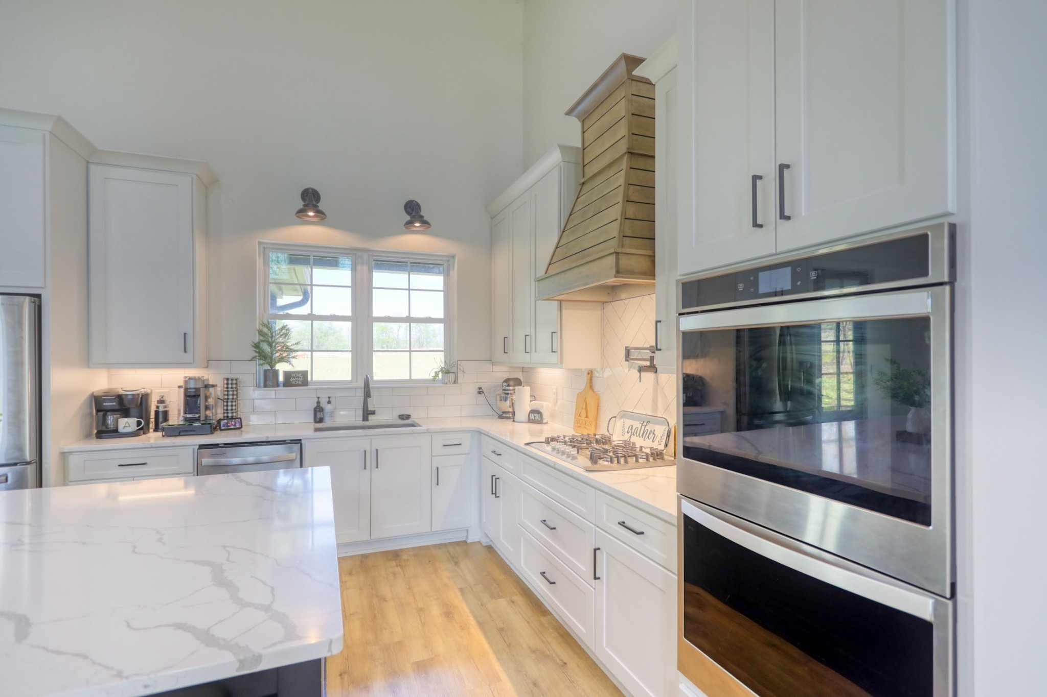 290 Dink Rut Road Portland, TN 37148 - Photo 10 of 56 a large white kitchen with granite countertop a stove and a sink