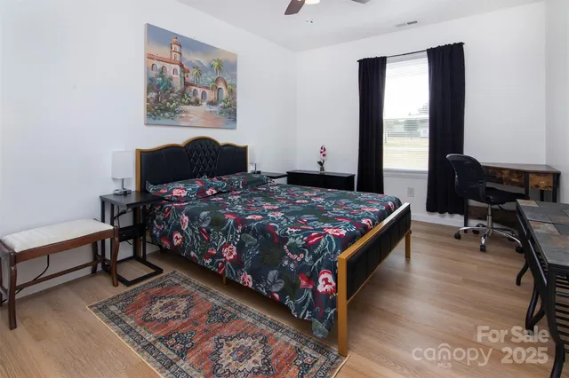 a bedroom with bed and a window