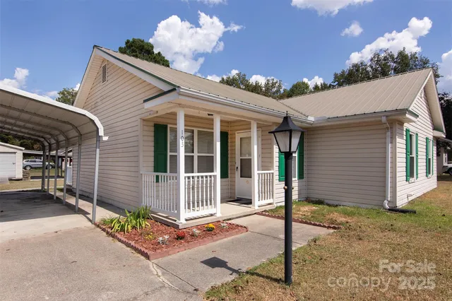 a front view of a house with a glass windows