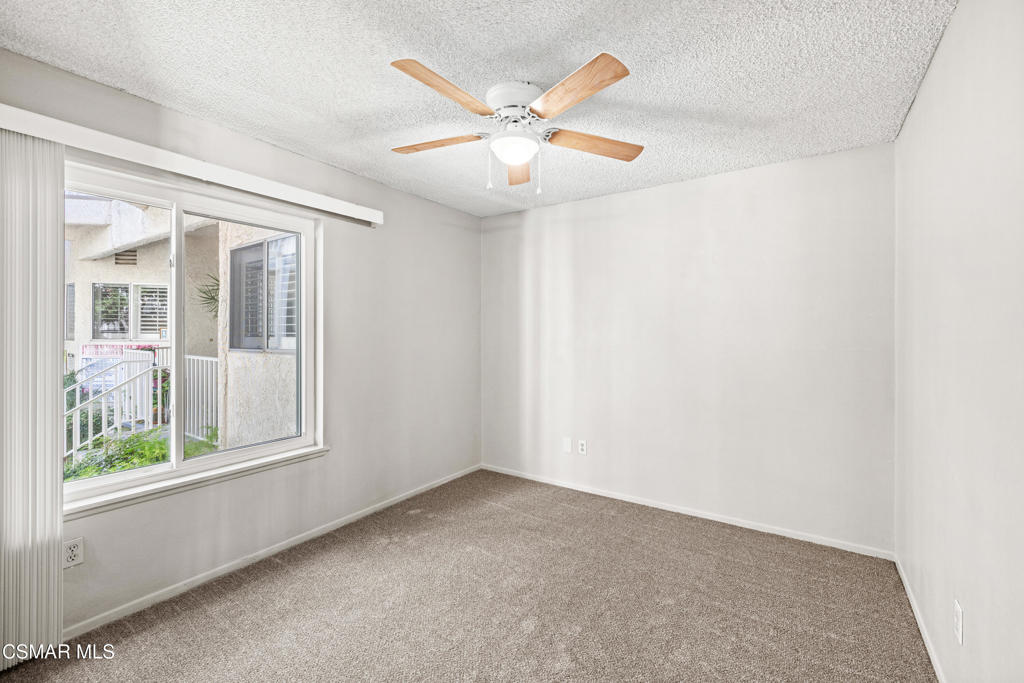 3354 Darby Street, Unit 313 Simi Valley, CA 93063 - Photo 20 of 30 an empty room with windows and fan