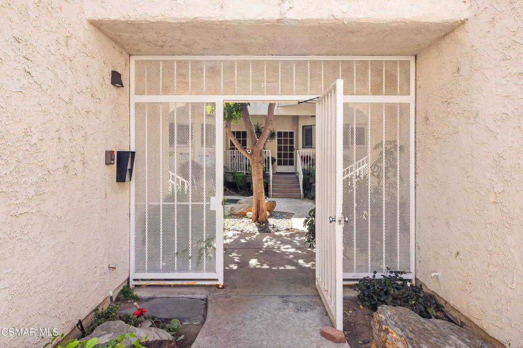 3354 Darby Street, Unit 313 Simi Valley, CA 93063 - Photo 3 of 30 a view of entryway with wooden floor and a window