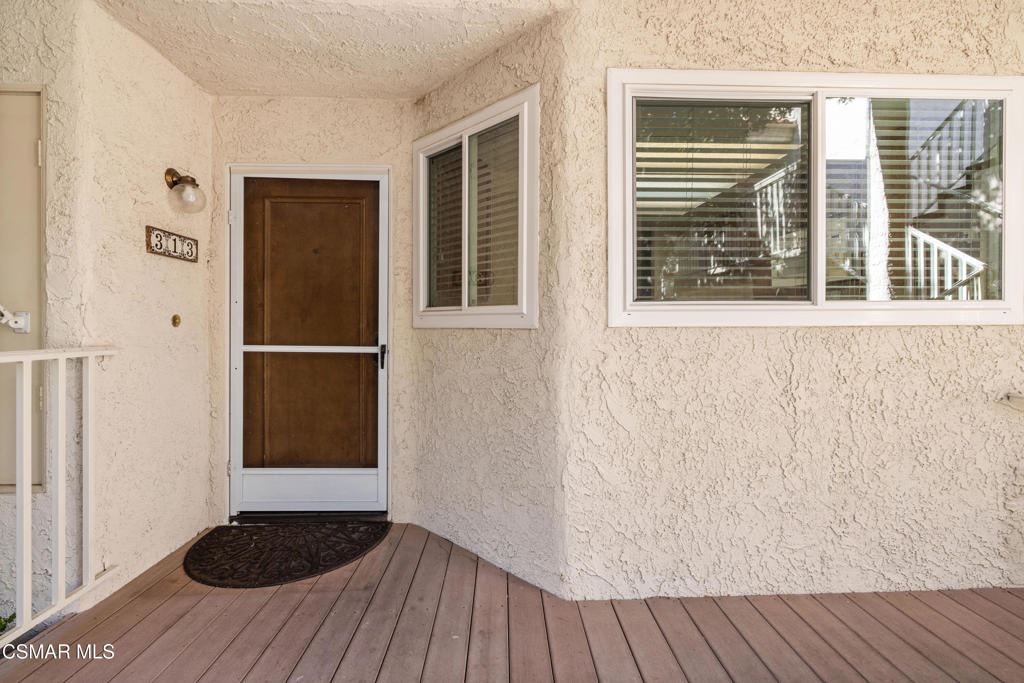 3354 Darby Street, Unit 313 Simi Valley, CA 93063 - Photo 5 of 30 a view of front door with wooden floor