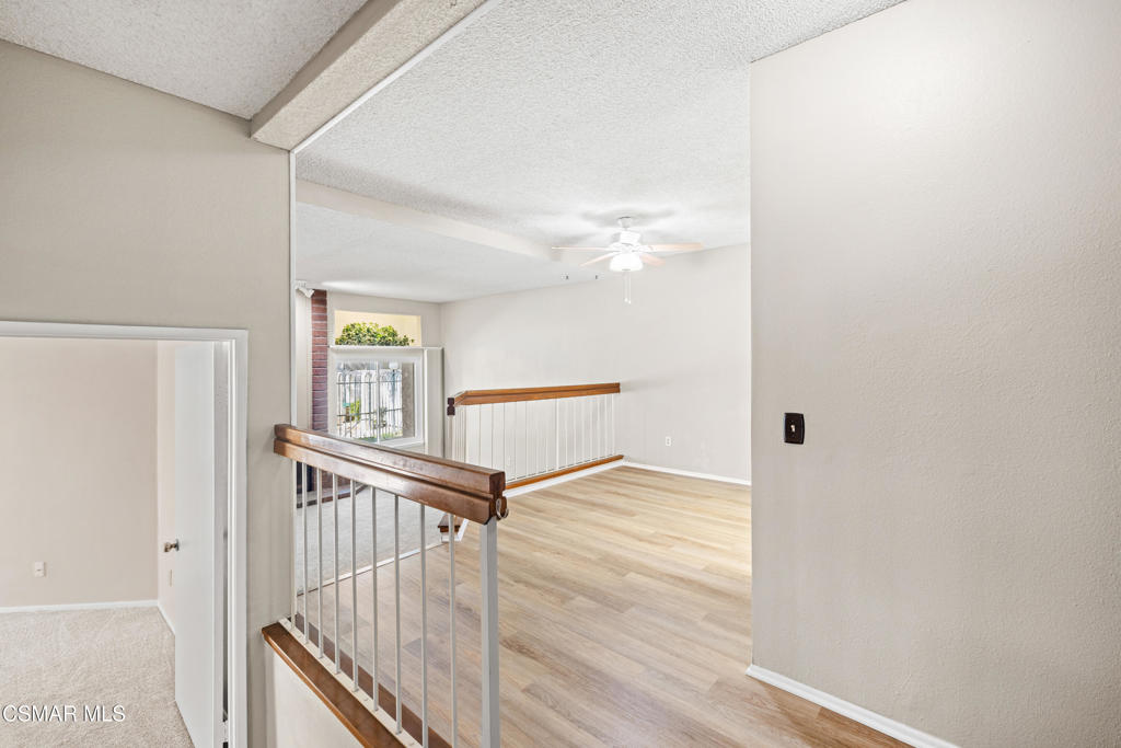 3354 Darby Street, Unit 313 Simi Valley, CA 93063 - Photo 6 of 30 a view of a hallway with windows