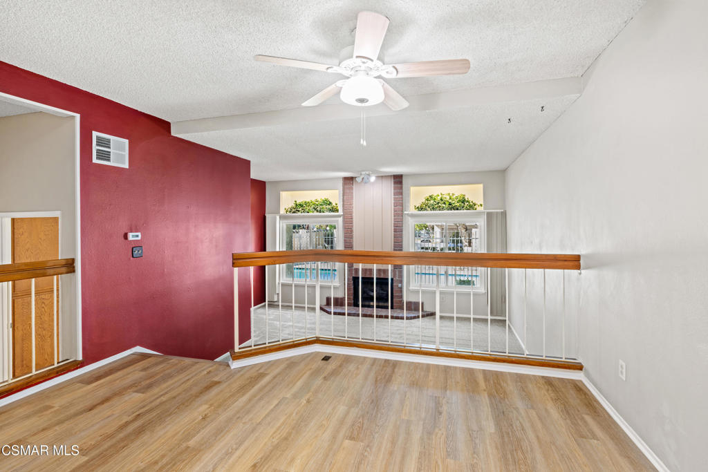 3354 Darby Street, Unit 313 Simi Valley, CA 93063 - Photo 10 of 30 a view of an empty room with window and wooden floor