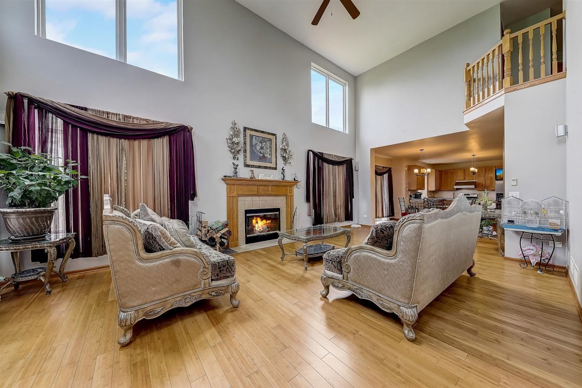 364 Stonegate Road Bolingbrook, IL 60440 - Photo 14 of 39 a living room with furniture and a fireplace