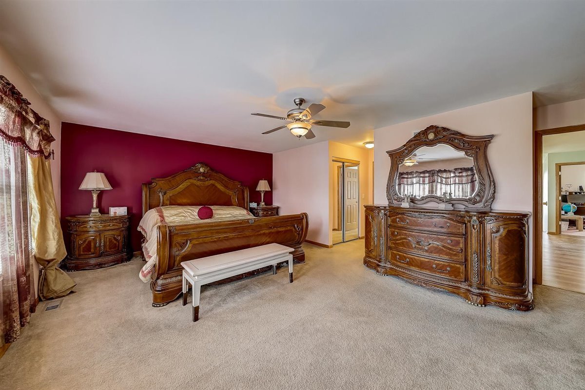 364 Stonegate Road Bolingbrook, IL 60440 - Photo 22 of 39 a bedroom with furniture and a ceiling fan