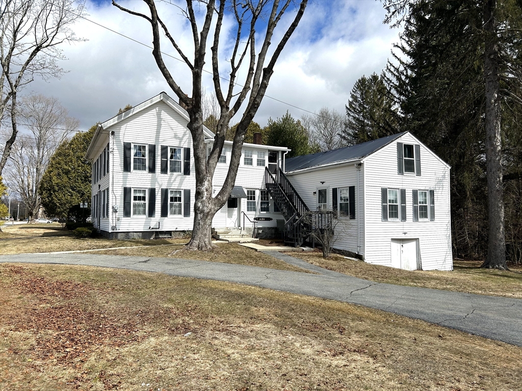 1386 Pleasant Street Athol, MA 01331 - Photo 2 of 11 a front view of a house with a yard