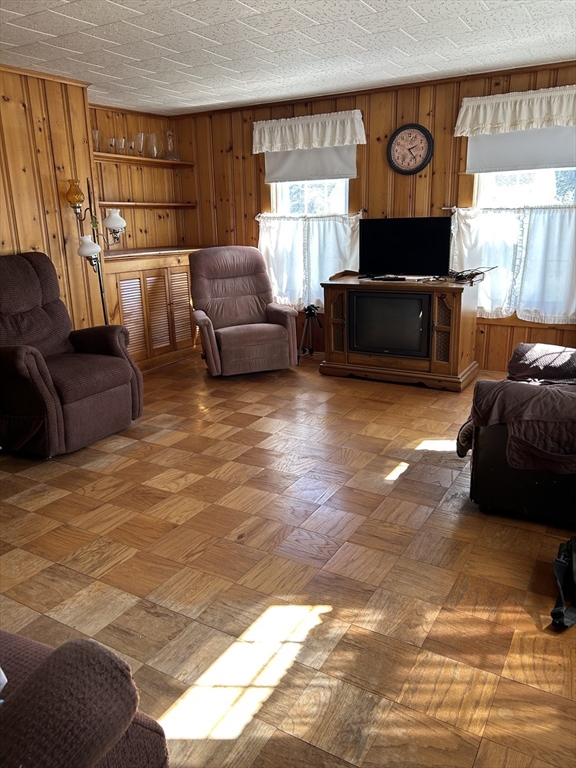 1386 Pleasant Street Athol, MA 01331 - Photo 5 of 11 a living room with furniture a fireplace and a large window