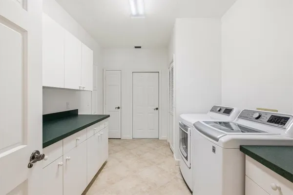a kitchen with a stove and a refrigerator