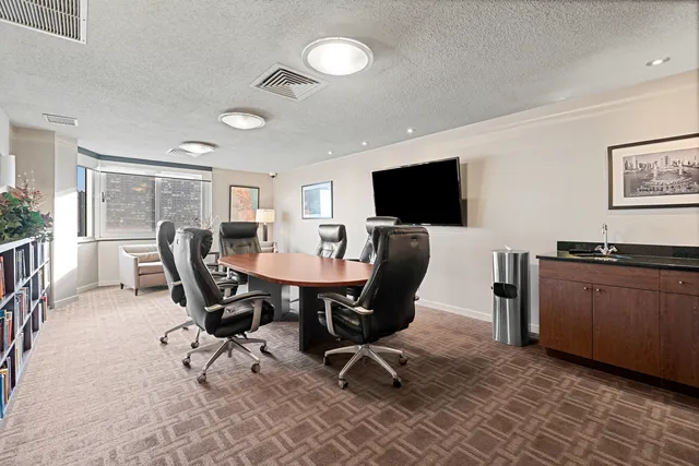 a living room with furniture and next to a window