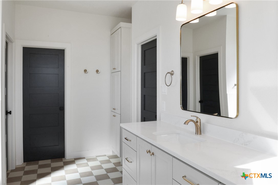 16026 Honey Ridge Drive Holland, TX 76534 - Photo 24 of 27 a bathroom with a sink and a mirror