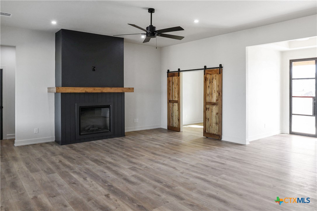 16026 Honey Ridge Drive Holland, TX 76534 - Photo 6 of 27 a view of an empty room with a fireplace and a window