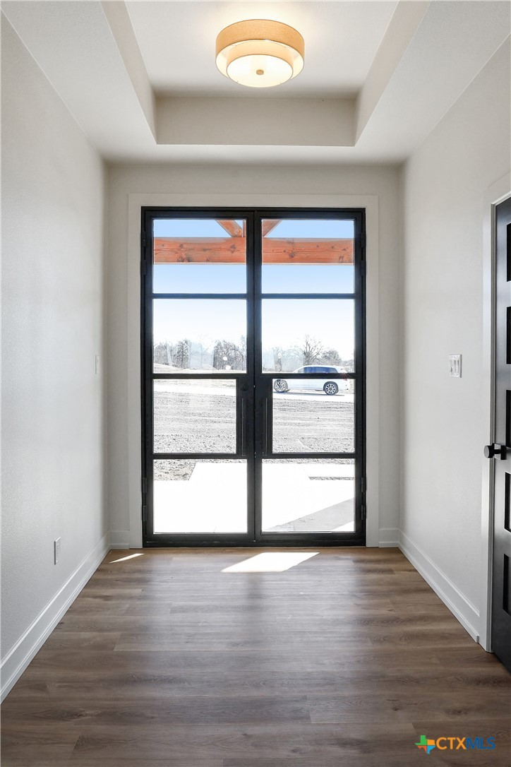 16026 Honey Ridge Drive Holland, TX 76534 - Photo 7 of 27 a view of empty room with wooden floor and fan