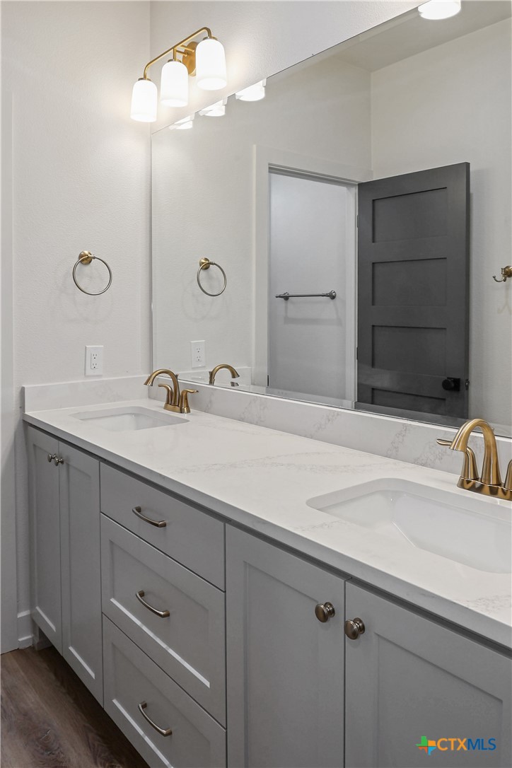 16026 Honey Ridge Drive Holland, TX 76534 - Photo 10 of 27 a bathroom with a sink and a mirror