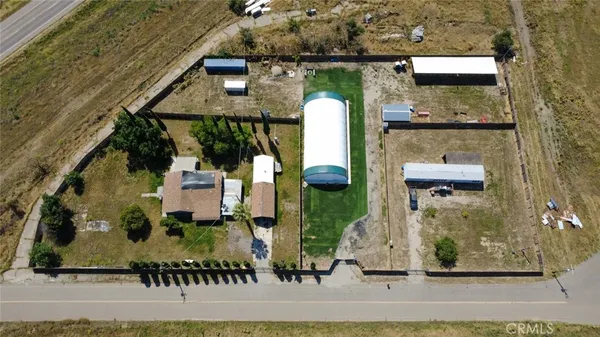 an aerial view of a house with outdoor space