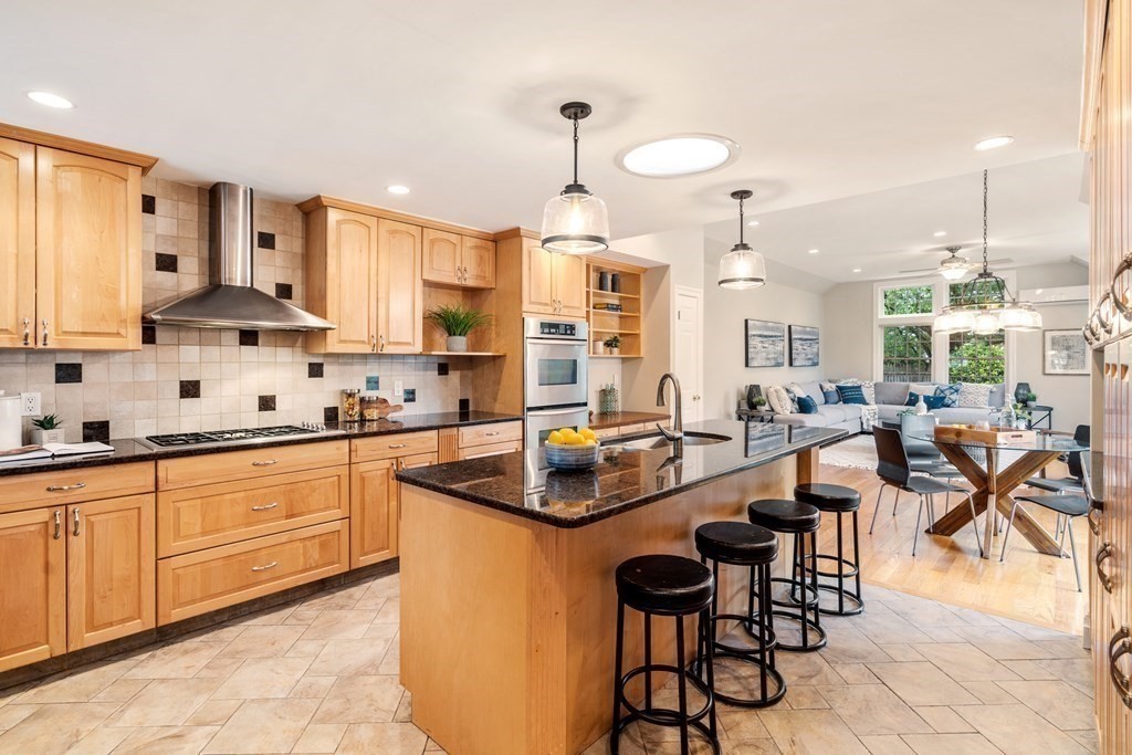 41 Janet Road Newton, MA 02459 - Photo 12 of 37 a kitchen with counter space cabinets dining table and chairs