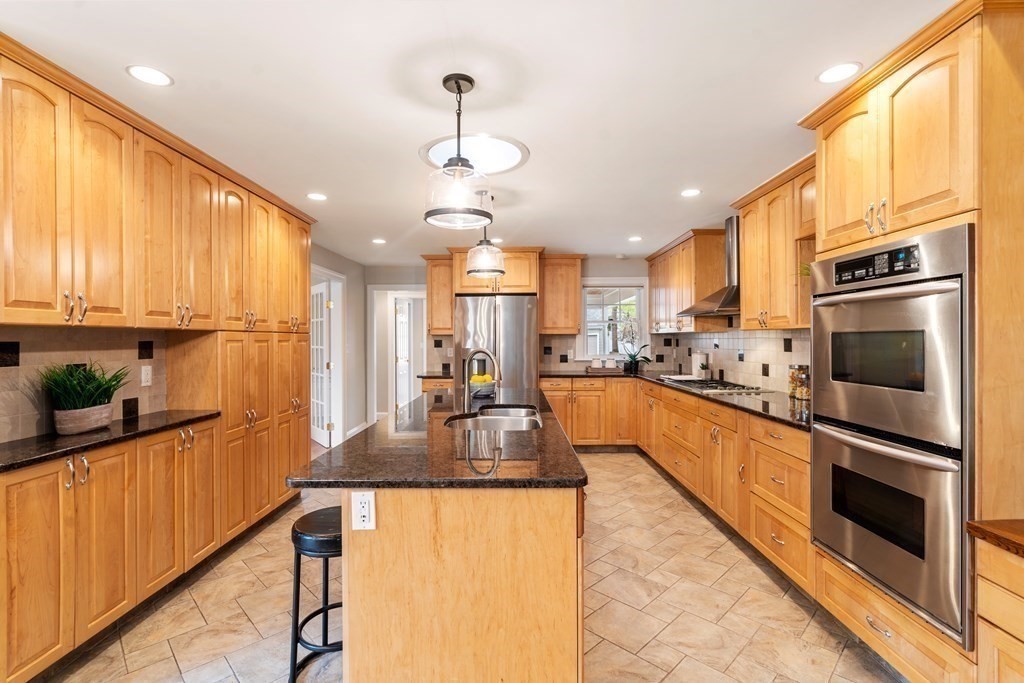 41 Janet Road Newton, MA 02459 - Photo 13 of 37 a large kitchen with granite countertop a large counter top stainless steel appliances and cabinets