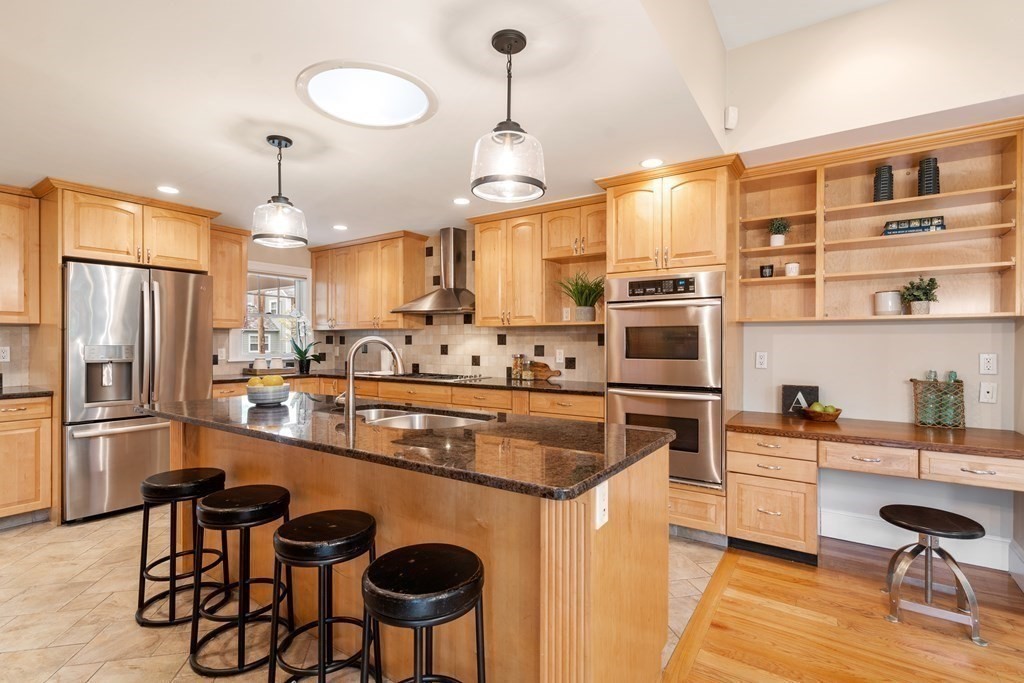 41 Janet Road Newton, MA 02459 - Photo 14 of 37 a kitchen with stainless steel appliances a stove a sink dishwasher a refrigerator and cabinets with wooden floor