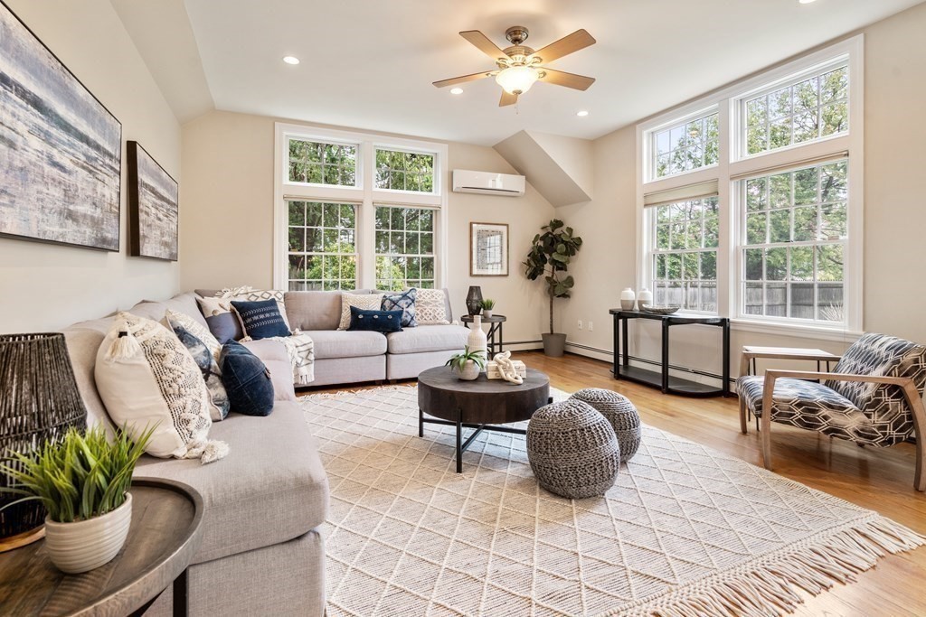 41 Janet Road Newton, MA 02459 - Photo 19 of 37 a living room with furniture floor to ceiling window and a table