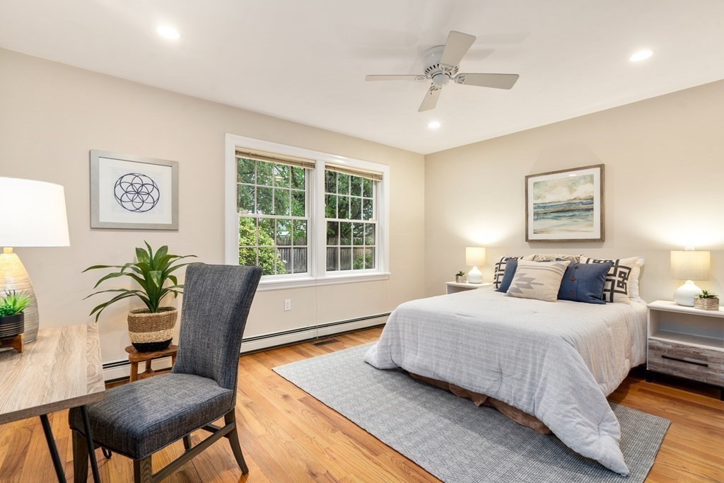 41 Janet Road Newton, MA 02459 - Photo 21 of 37 a bedroom with a large bed and a potted plant