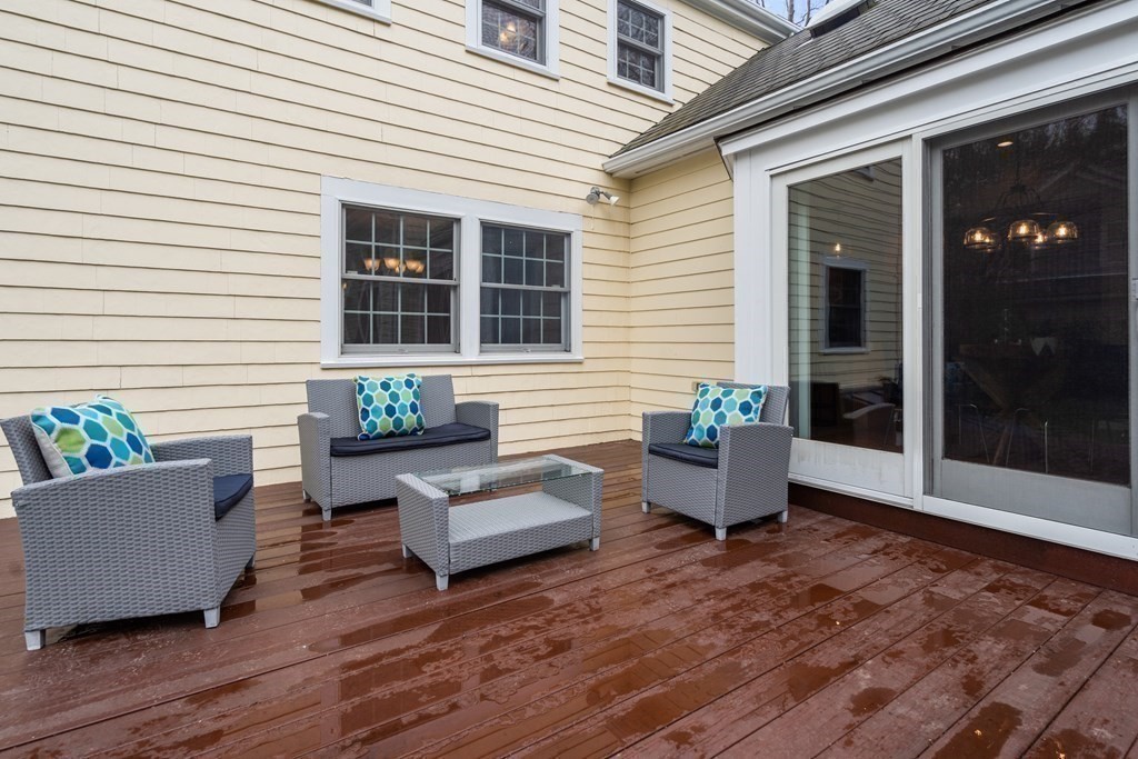 41 Janet Road Newton, MA 02459 - Photo 31 of 37 a view of a patio with couches potted plants and wooden floor