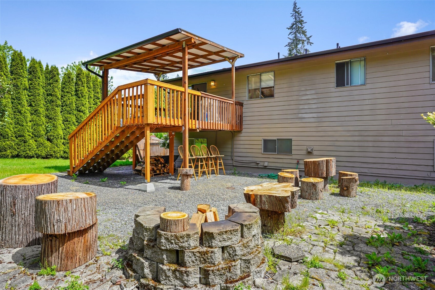 16604 3rd Avenue Southeast Bothell, WA 98012 - Photo 21 of 22 a view of a chairs and table in backyard of the house