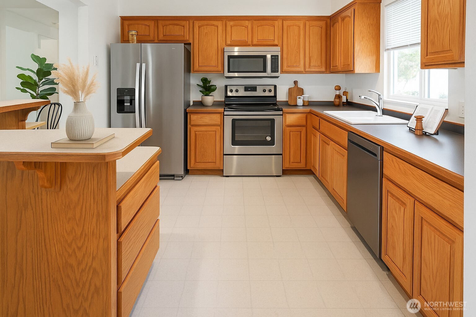 16604 3rd Avenue Southeast Bothell, WA 98012 - Photo 3 of 22 a kitchen with stainless steel appliances a refrigerator a sink a stove a microwave and cabinets