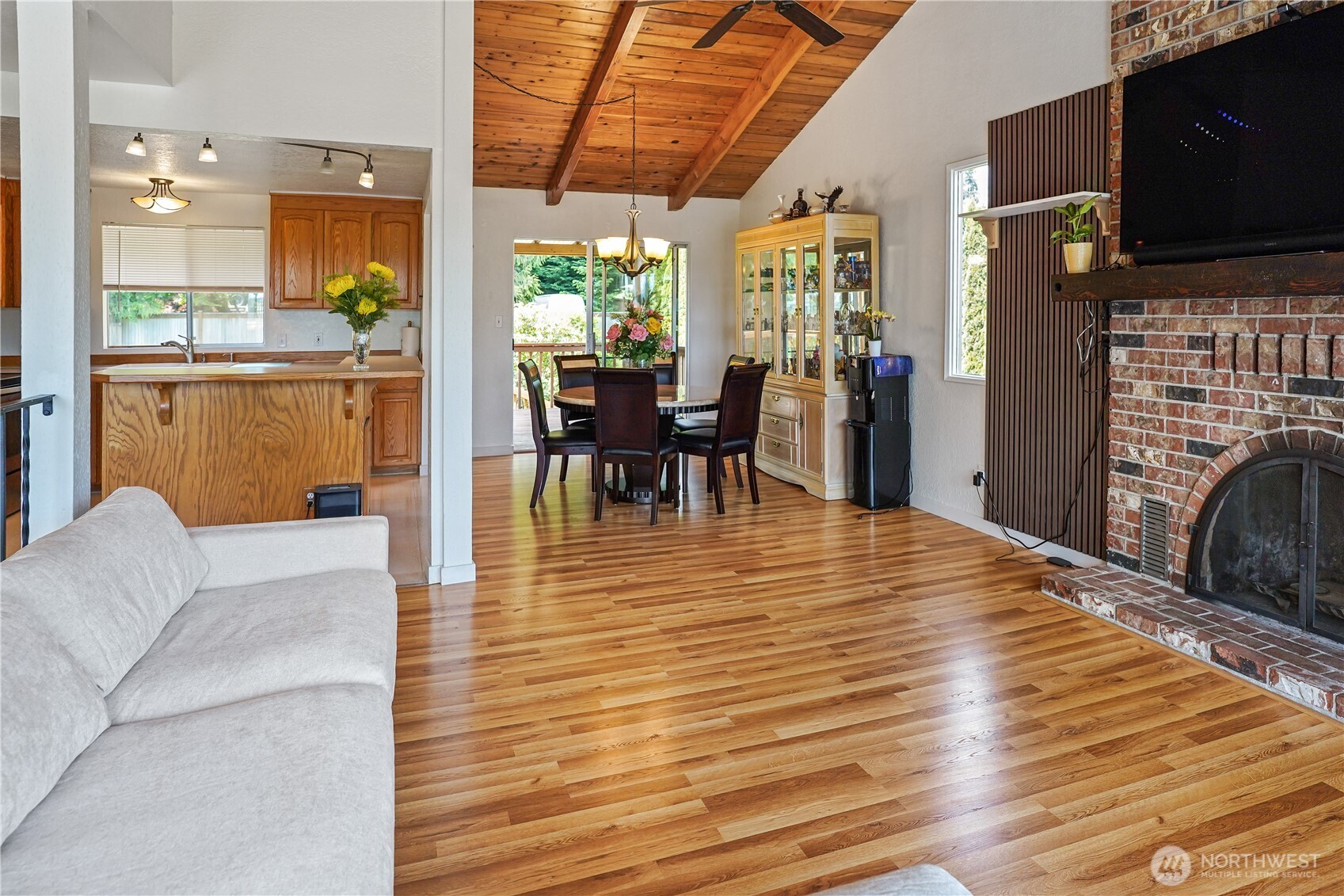 16604 3rd Avenue Southeast Bothell, WA 98012 - Photo 8 of 22 a living room with furniture a flat screen tv and a table