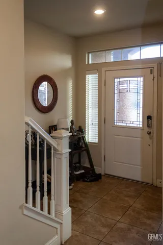 a very nice looking room with a large window and white walls