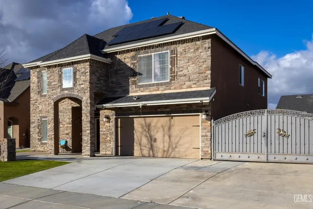 a front view of a house with a garage