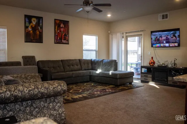 a living room with furniture and a window