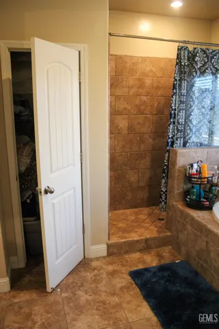 a view of a bathroom with a sink and a shower