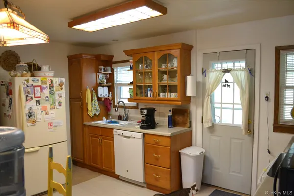 a kitchen with stainless steel appliances a refrigerator and a sink