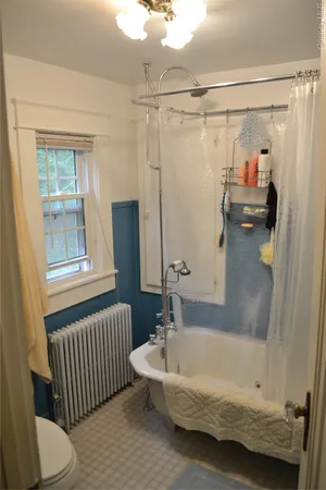 a bathroom with a tub and a shower