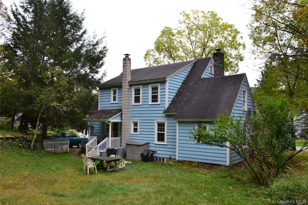 a aerial view of a house with garden and sitting area