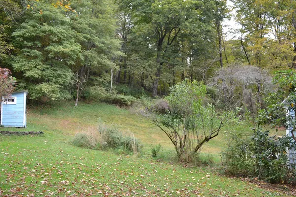 a view of outdoor space with deck and yard