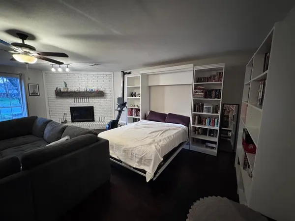 a bed room with a bed and a fireplace