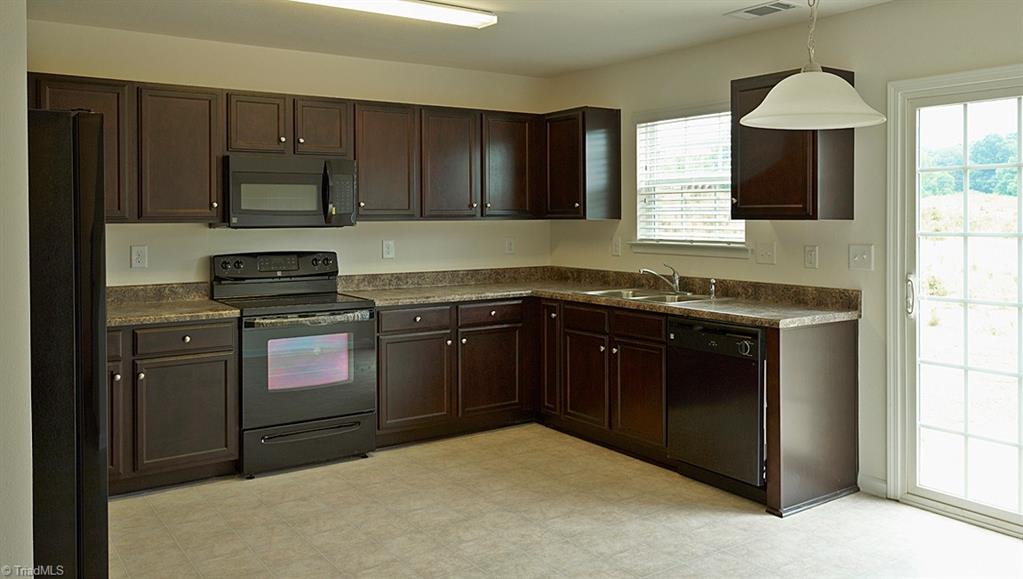 1924 Longshadow Street Rural Hall, NC 27045 - Photo 12 of 20 Kitchen/Breakfast. This picture is to illustrate the Brookchase floor plan only and is not the actual home. The actual home is currently under construction. Options and color selection may vary in actual home.