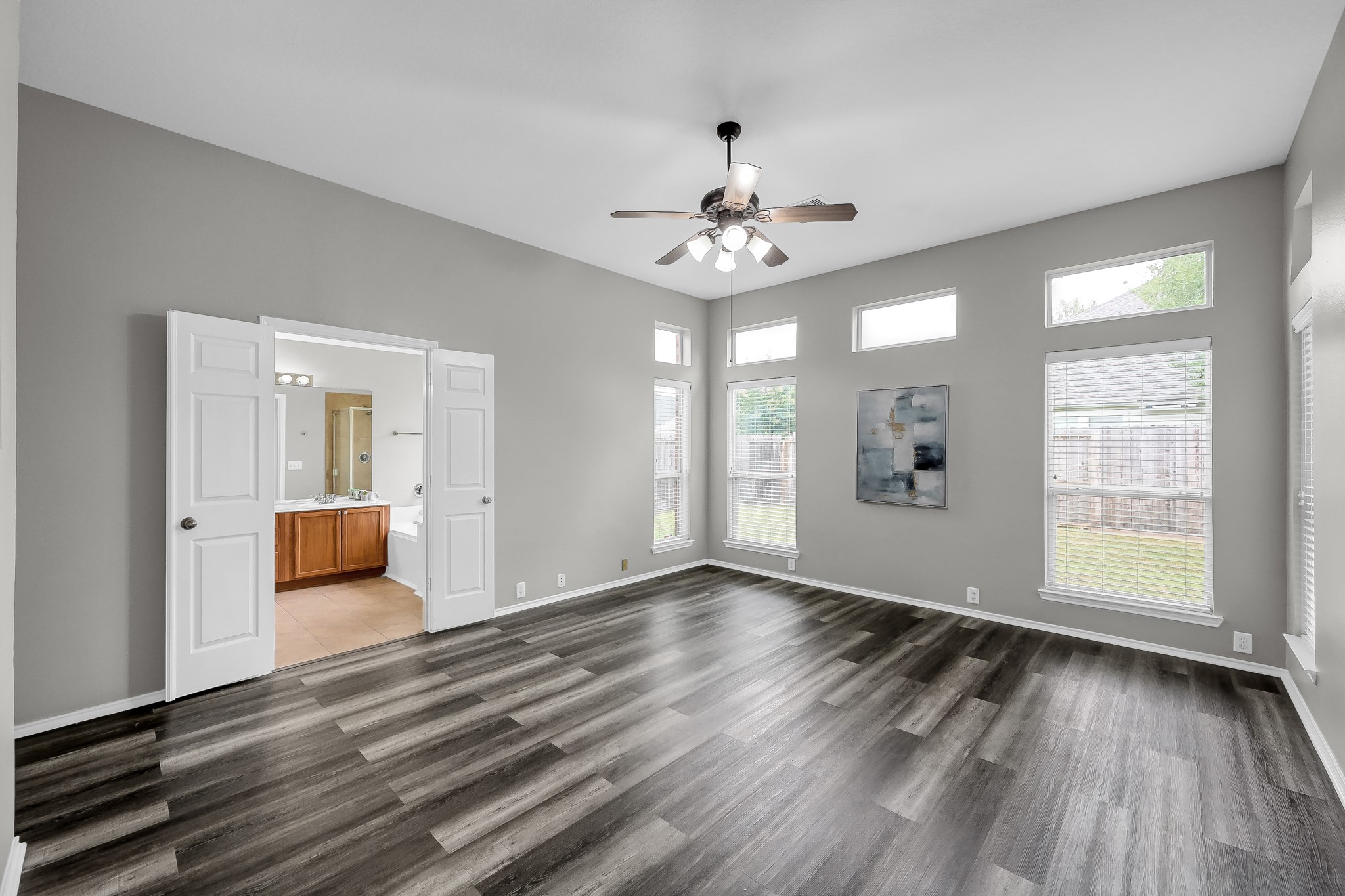 30206 Mesa Valley Drive Spring, TX 77386 - Photo 18 of 38 an empty room with wooden floor and windows